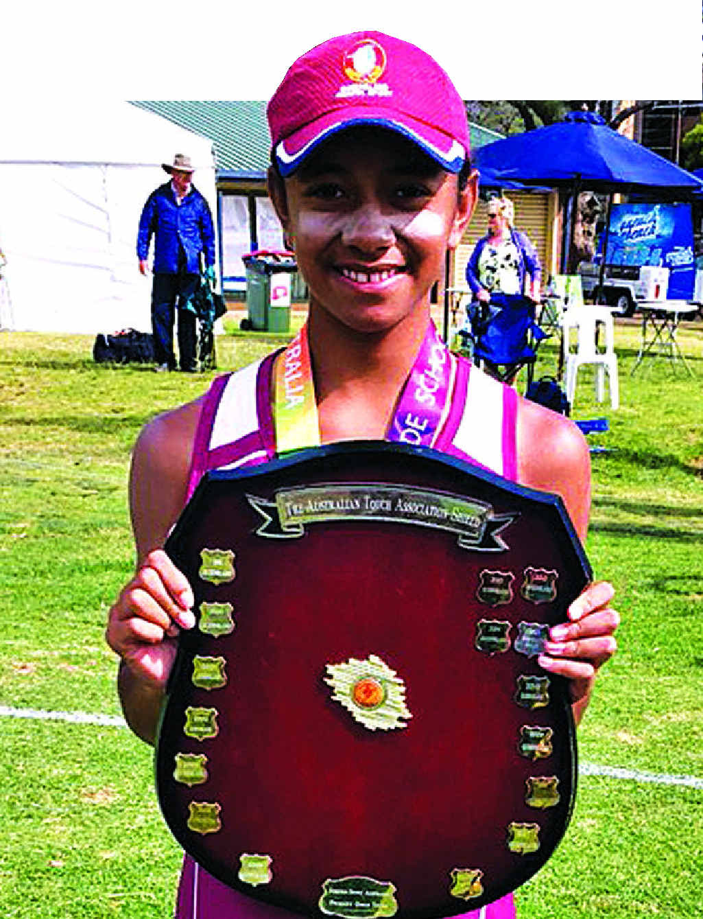 Emma Paki with the under-12s school girls touch trophy she won in Adelaide last year. Emma Paki with the under-12s school girls touch trophy she won in Adelaide last year.